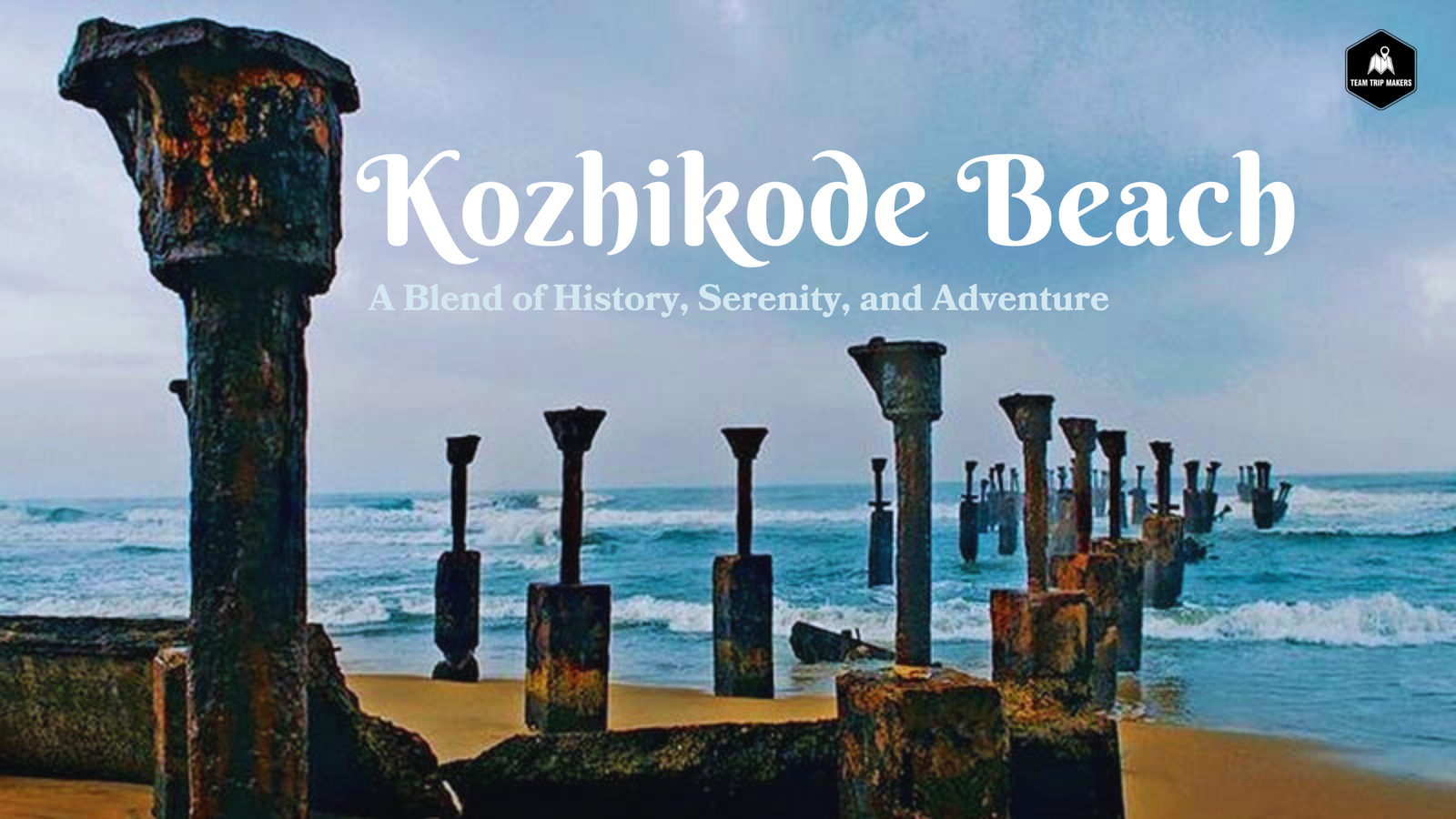 Scenic view of Kozhikode Beach during sunset: golden hues reflecting on the waves, fishing boats anchored near the shore, and people strolling along the sandy beach, soaking in the serene coastal atmosphere.